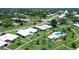 Aerial view of property showcasing home, landscaping, and community pool at 3641 Somerville Dr # 1506, Sarasota, FL 34232