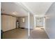 Unfinished basement space with storage cabinets, concrete floors, and lighting at 3641 Somerville Dr # 1506, Sarasota, FL 34232