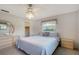 Bright bedroom features a neutral color scheme, ceiling fan, and ample natural light at 3641 Somerville Dr # 1506, Sarasota, FL 34232