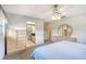 This bedroom features carpet floors, a ceiling fan, an ensuite bathroom and dual closets at 3641 Somerville Dr # 1506, Sarasota, FL 34232