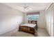 Comfortable bedroom featuring a ceiling fan, closet, and a window at 3641 Somerville Dr # 1506, Sarasota, FL 34232