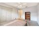 Comfortable bedroom featuring a ceiling fan and a large closet at 3641 Somerville Dr # 1506, Sarasota, FL 34232