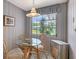 Charming breakfast nook with a glass table and views of the garden at 3641 Somerville Dr # 1506, Sarasota, FL 34232