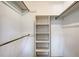 This walk-in closet contains both shelves and hanging rods for storage at 3641 Somerville Dr # 1506, Sarasota, FL 34232