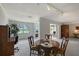 Bright dining space with a wooden table, adjacent to the living area, offering a seamless transition for gatherings at 3641 Somerville Dr # 1506, Sarasota, FL 34232