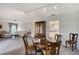 Cozy dining area with a round table, adjacent to the living room and kitchen at 3641 Somerville Dr # 1506, Sarasota, FL 34232