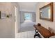 Inviting entryway with neutral tile flooring, a console table, and a mirror creating a welcoming atmosphere at 3641 Somerville Dr # 1506, Sarasota, FL 34232