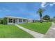 Beautiful single-story home with manicured lawn and mature palm tree at 3641 Somerville Dr # 1506, Sarasota, FL 34232