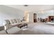Spacious living area with plush seating and seamless access to the dining area, perfect for entertaining and relaxation at 3641 Somerville Dr # 1506, Sarasota, FL 34232