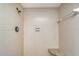 The shower has a built in bench and a classic shower head at 3641 Somerville Dr # 1506, Sarasota, FL 34232