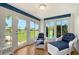 Inviting sunroom featuring comfortable seating and views of the outdoors at 3641 Somerville Dr # 1506, Sarasota, FL 34232