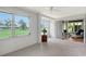 Bright sunroom with large windows offering views of the landscaped yard at 3641 Somerville Dr # 1506, Sarasota, FL 34232