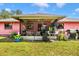Backyard area featuring lush greenery, patio and barbeque setup at 4145 W Price Blvd, North Port, FL 34286