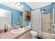 Bathroom featuring a single sink vanity, a toilet, and a shower/tub combo with a shower curtain at 4145 W Price Blvd, North Port, FL 34286