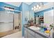 Bathroom featuring a large vanity, a shower-tub combo with sliding glass doors, and ample lighting at 4145 W Price Blvd, North Port, FL 34286