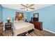 Bedroom with a ceiling fan, wood floors, a television, a dresser and a window with curtains at 4145 W Price Blvd, North Port, FL 34286