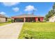 Inviting single-Gathering home with a large front yard and vibrant landscaping at 4145 W Price Blvd, North Port, FL 34286