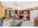 Bright kitchen with wood cabinets, tile flooring, and a dining area with seating at 4145 W Price Blvd, North Port, FL 34286