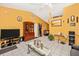 Open living room with tile flooring, a decorative mirror, and stylish furnishings at 4145 W Price Blvd, North Port, FL 34286