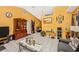 Spacious living room with tile flooring, large windows, and comfortable seating area at 4145 W Price Blvd, North Port, FL 34286