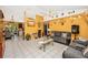 Bright living room with tile floors, ceiling fan, and stylish decor on display shelves at 4145 W Price Blvd, North Port, FL 34286