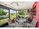 Outdoor patio with a table, chairs, and a view of the backyard at 4145 W Price Blvd, North Port, FL 34286