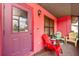 Covered porch with comfortable seating area, perfect for relaxing at 4145 W Price Blvd, North Port, FL 34286