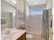 Bathroom featuring a shower-tub combo, single sink vanity, and coordinated accessories at 4200 Reflections Pkwy, Sarasota, FL 34233