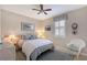 Cozy bedroom featuring a comfortable bed, shuttered window, and decorative furnishings at 4200 Reflections Pkwy, Sarasota, FL 34233