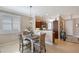Charming dining area with wicker chairs and modern light fixture at 4200 Reflections Pkwy, Sarasota, FL 34233