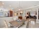 Dining area with a rustic table and decorative light fixture, open layout at 4200 Reflections Pkwy, Sarasota, FL 34233