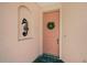 Inviting front door features seahorse decor and a charming welcome wreath at 4200 Reflections Pkwy, Sarasota, FL 34233