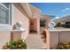 Charming front entrance with brick walkway and manicured flowerbeds at 4200 Reflections Pkwy, Sarasota, FL 34233
