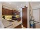 Well-equipped kitchen featuring stainless steel appliances, granite countertops, and dark wood cabinetry at 4200 Reflections Pkwy, Sarasota, FL 34233