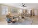 Open-concept living room and kitchen area with comfortable seating and abundant natural light at 4200 Reflections Pkwy, Sarasota, FL 34233