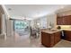 Open-concept living space with modern cabinetry, granite counters, and water views at 4200 Reflections Pkwy, Sarasota, FL 34233