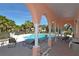 Inviting covered pool area with lounge chairs, tables, and well-maintained pool at 4200 Reflections Pkwy, Sarasota, FL 34233