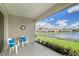 This screened patio overlooks the lake and provides outdoor living space at 4200 Reflections Pkwy, Sarasota, FL 34233