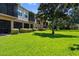 Lush backyard of townhome community with green grass and trees at 4235 Overture Cir # 4235, Bradenton, FL 34209