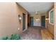 Townhome entryway featuring individual unit doors, brick pavers, overhead lighting, and stucco walls at 4235 Overture Cir # 4235, Bradenton, FL 34209