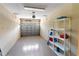 Garage space with open door, grey floor, and shelving at 4235 Overture Cir # 4235, Bradenton, FL 34209
