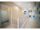 Upper level hallway with beach themed decorations, with access to a bathroom and bedrooms at 4235 Overture Cir # 4235, Bradenton, FL 34209