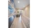 Second story hallway with beach themed decorations, and access to the main living area at 4235 Overture Cir # 4235, Bradenton, FL 34209