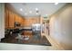 The kitchen boasts stainless appliances, granite counters, and a functional breakfast bar at 4235 Overture Cir # 4235, Bradenton, FL 34209