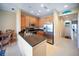 Kitchen with stainless steel appliances, breakfast bar, and easy access to dining area at 4235 Overture Cir # 4235, Bradenton, FL 34209