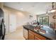 Open kitchen with stainless appliances and breakfast bar overlooks a comfortable living space at 4235 Overture Cir # 4235, Bradenton, FL 34209