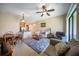 Open living space connects to kitchen, complemented by cozy seating and natural lighting at 4235 Overture Cir # 4235, Bradenton, FL 34209