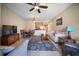 Comfortable living room offering ample seating, open layout and a ceiling fan for a cool living space at 4235 Overture Cir # 4235, Bradenton, FL 34209