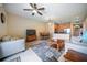 Inviting living room features neutral tones and an open layout to the dining and kitchen area at 4235 Overture Cir # 4235, Bradenton, FL 34209