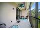 Relaxing screened patio with fan and wicker furniture offering serene outdoor living at 4235 Overture Cir # 4235, Bradenton, FL 34209